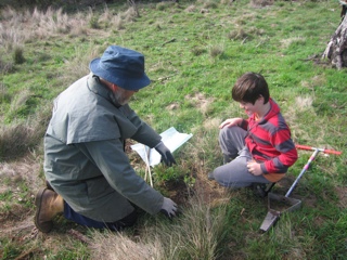 Bill Honey imparting his knowledge to a young tree planter
